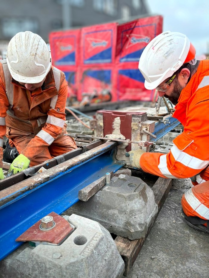Workers welding the final pieces of tram track along the Digbeth stretch of the Eastside Metro extension