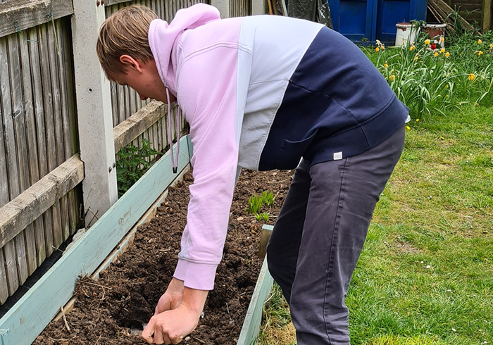 Alex gardening.