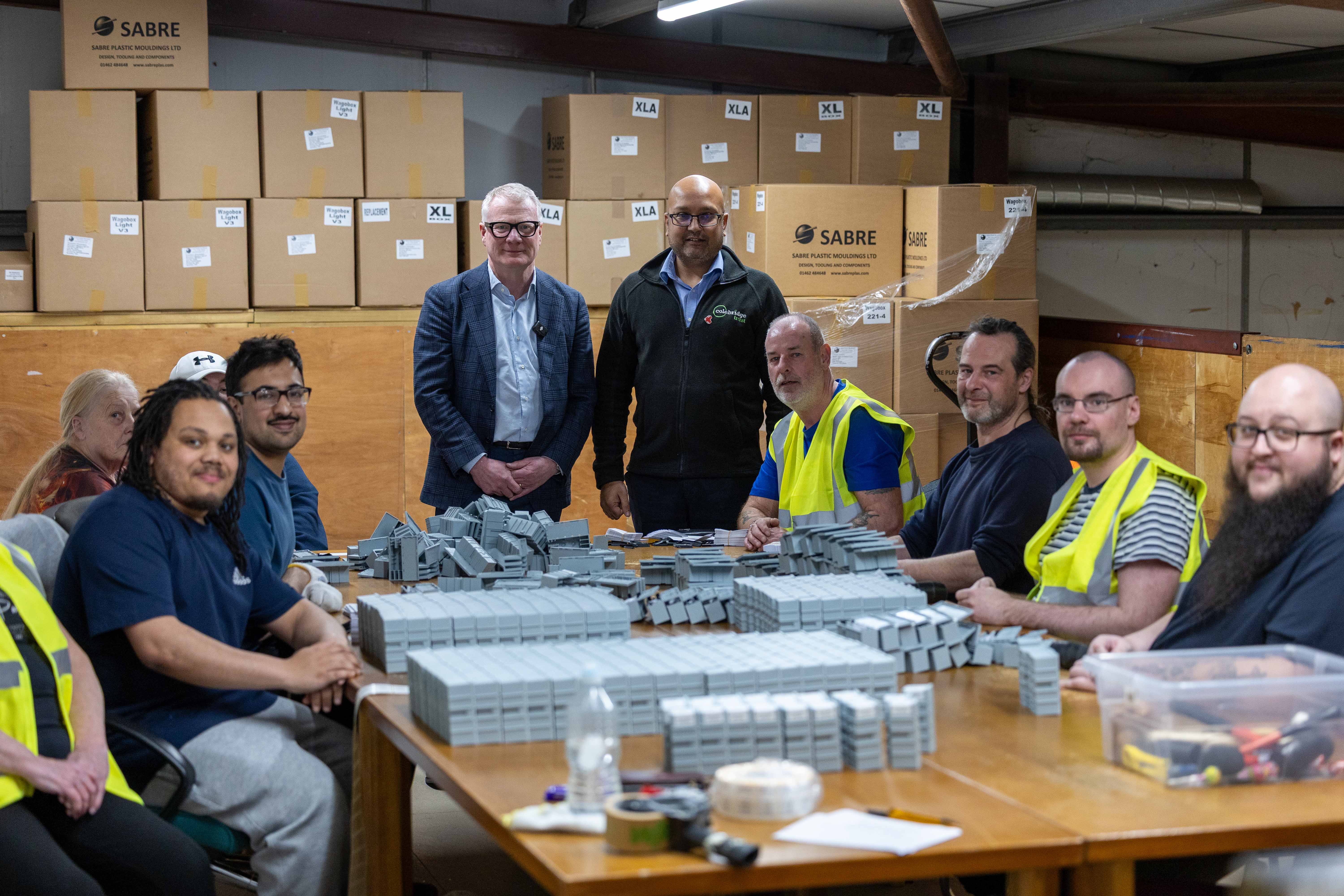 Mayor Richard Parker and Colebridge Trust CEO Chet Parmar with some of the workforce at Colebridge Enterprises.