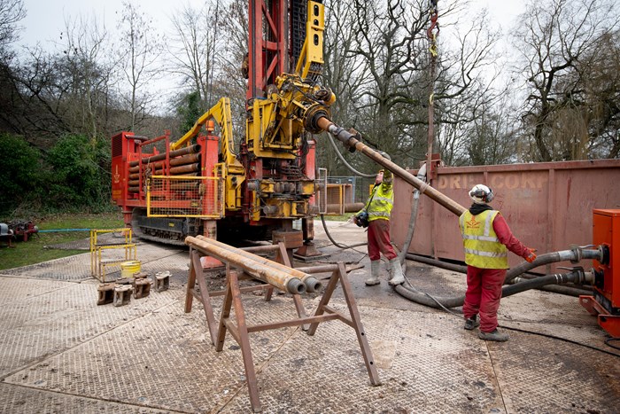 Construction workers with machinery