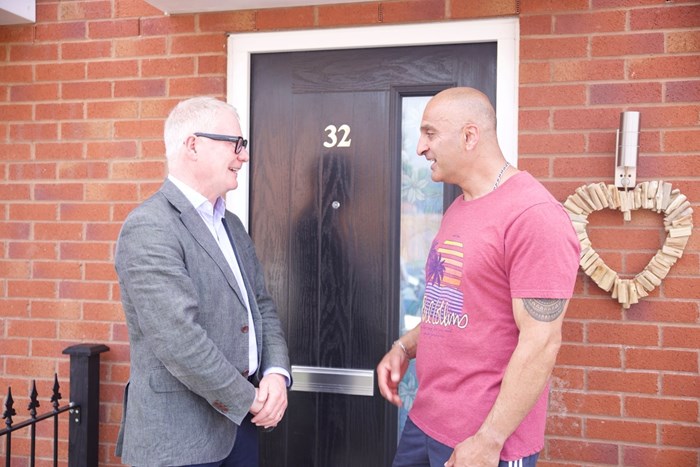 Mayor of the West Midlands Richard Parker (left) meets Tag Majid outside his new affordable home on the Cookley Works development in Brierley Hill