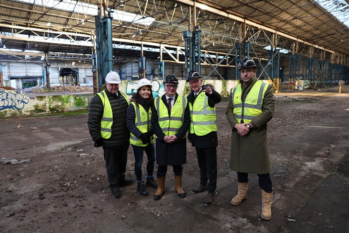 From left: Cllr Stephen Simkins, City of Wolverhampton Council Leader, Henriette Breukelaar, Regional Director, Canal & River Trust (West Midlands), Richard Parker, Mayor of the West Midlands, Pat McFadden, MP for Wolverhampton South East and James Dickens, Managing Director of Wavensmere Homes inside one of the giant derelict factories that dominate the canalside site