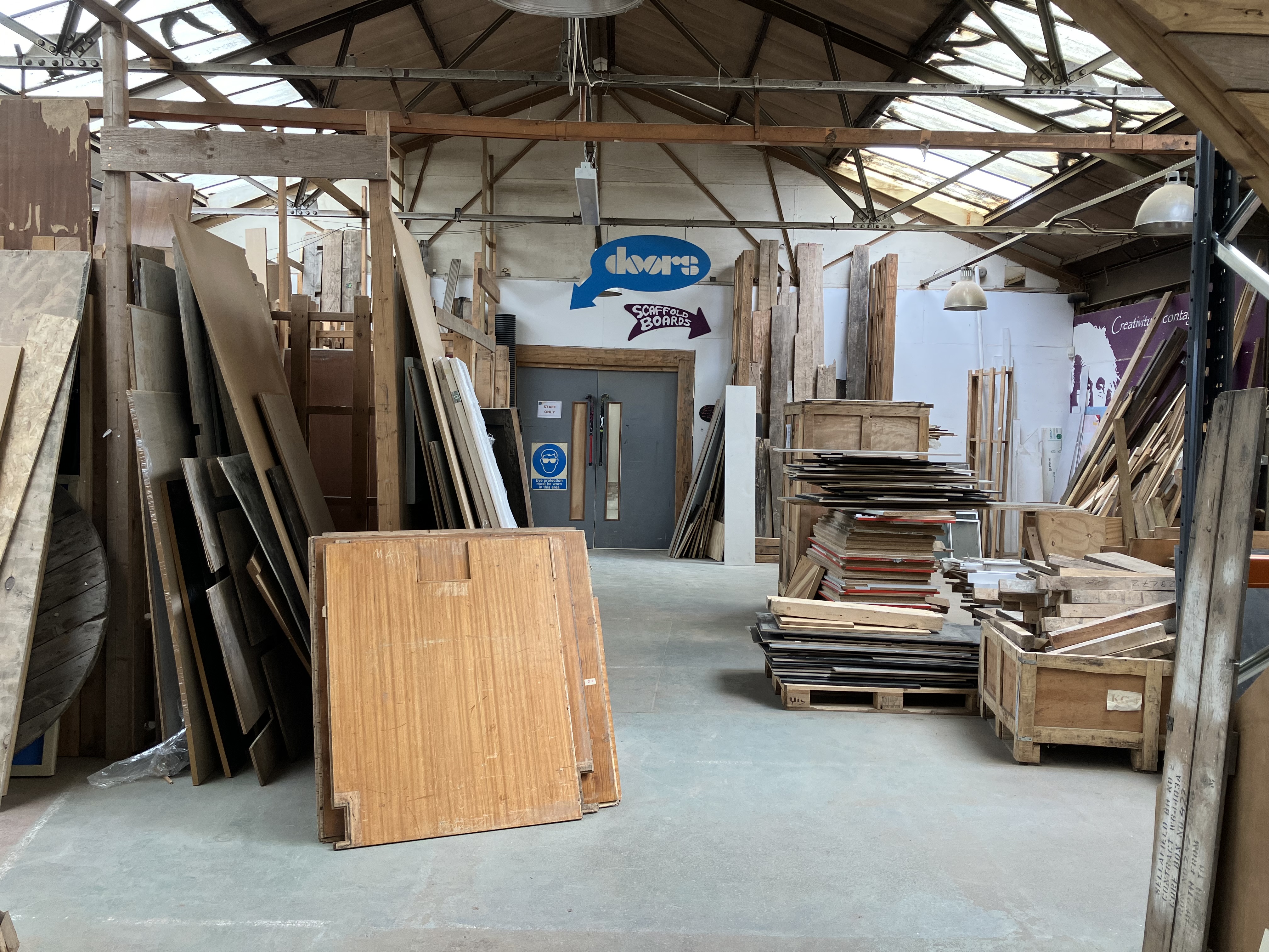 A warehouse full of wooden planks 