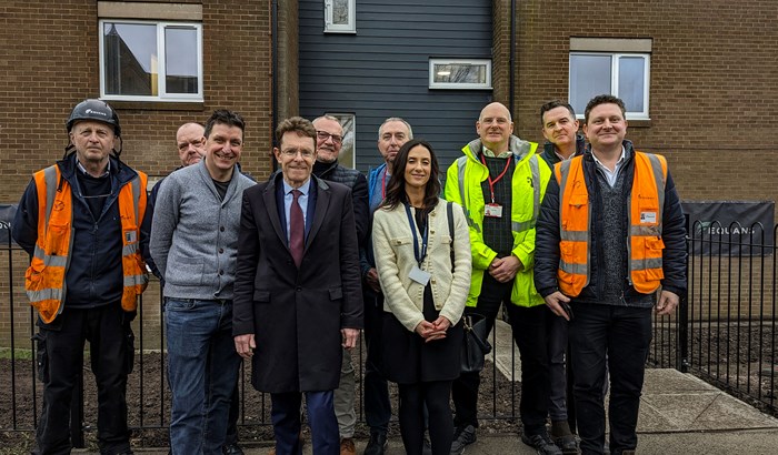 Derek Kirwan, site manager for Equans Regeneration; Jim Pollitt, assistant director of strategic development at Sandwell and West Birmingham NHS Trust; Barrie Hodge, head of fundraising and communications at St Basils; Mayor Andy Street; Rob Johnson, retrofit consortium manager at West Midlands Combined Authority; Richard Bubb, energy associate at St Basils; Rebecca Reynolds, sustainability manager at Equans Regeneration; Steve Hale, property services associate and project manager at St Basils; and John Boyle, operations manager, and Dan Sirrell, project manager, both from Equans.