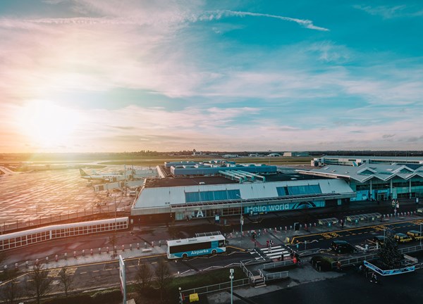 Ariel image of birmingham airport with the sun setting in the background 