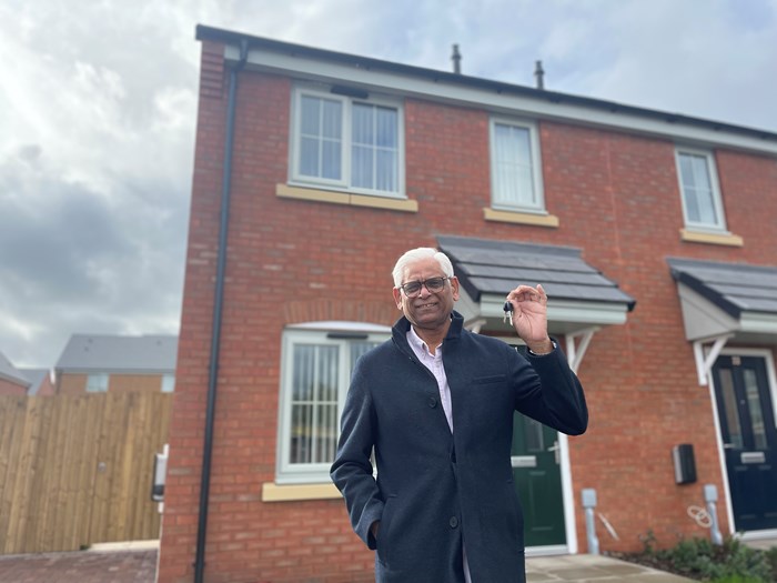 Mukarram Janhanzaib outside his new home on the Lockside development in Walsall