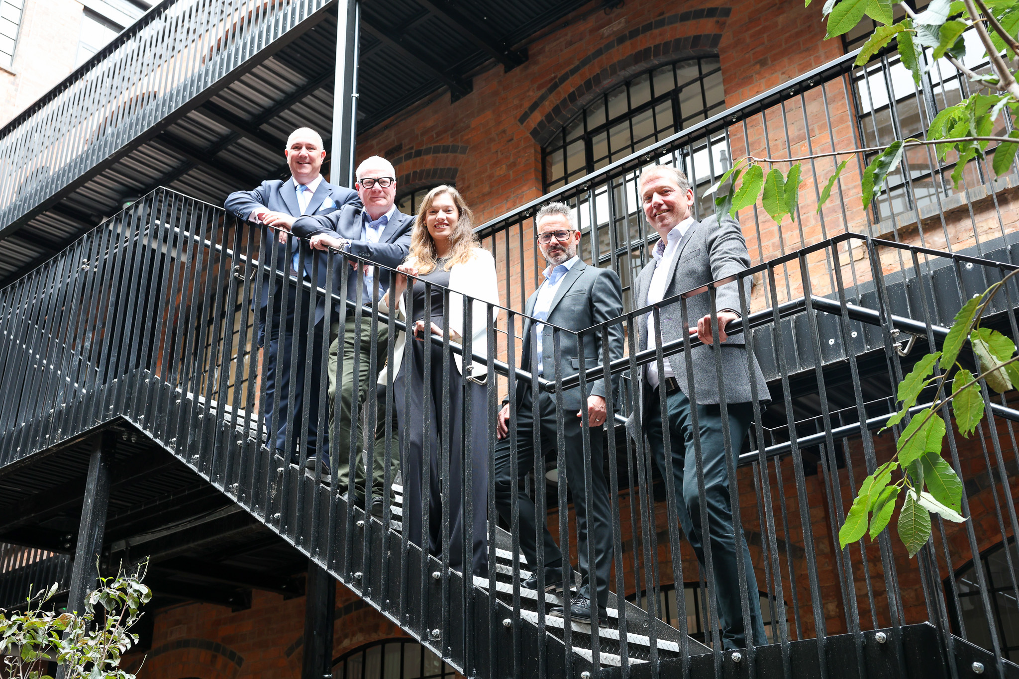 From left: Richard Whitehouse, director of Hanehouse Developments, Richard Parker, Mayor of the West Midlands, Sarah Edwards from BPN Architects, Jamie Davis, head of contracts at Kavannagh Construction and John Heath of Great Hampton Street Button Works Limited, in the restored courtyard