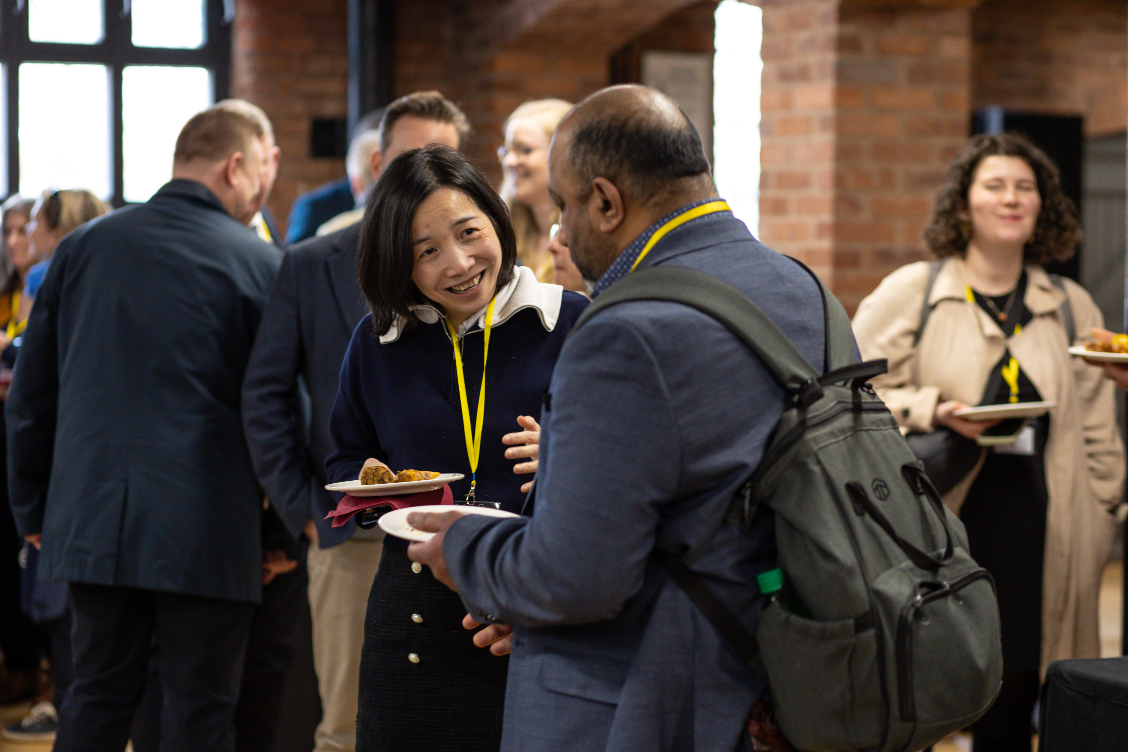 Two guests talking to each other at the conference 