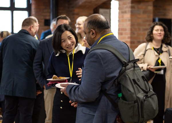 Two guests talking to each other at the conference 