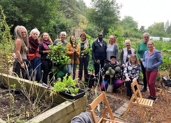 A group of people at an allotment 