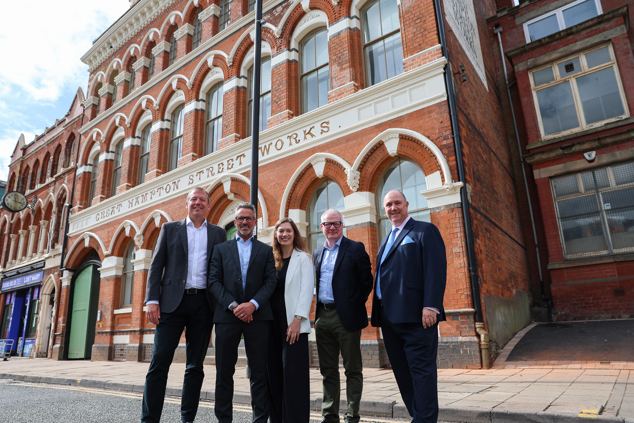 From left: John Heath of Great Hampton Street Button Works Limited, Jamie Davis, head of contracts at Kavannagh Construction, Sarah Edwards from BPN Architects, Richard Parker, Mayor of the West Midlands and Richard Whitehouse, director of Hanehouse Developments outside the restored Great Hampton Street Works